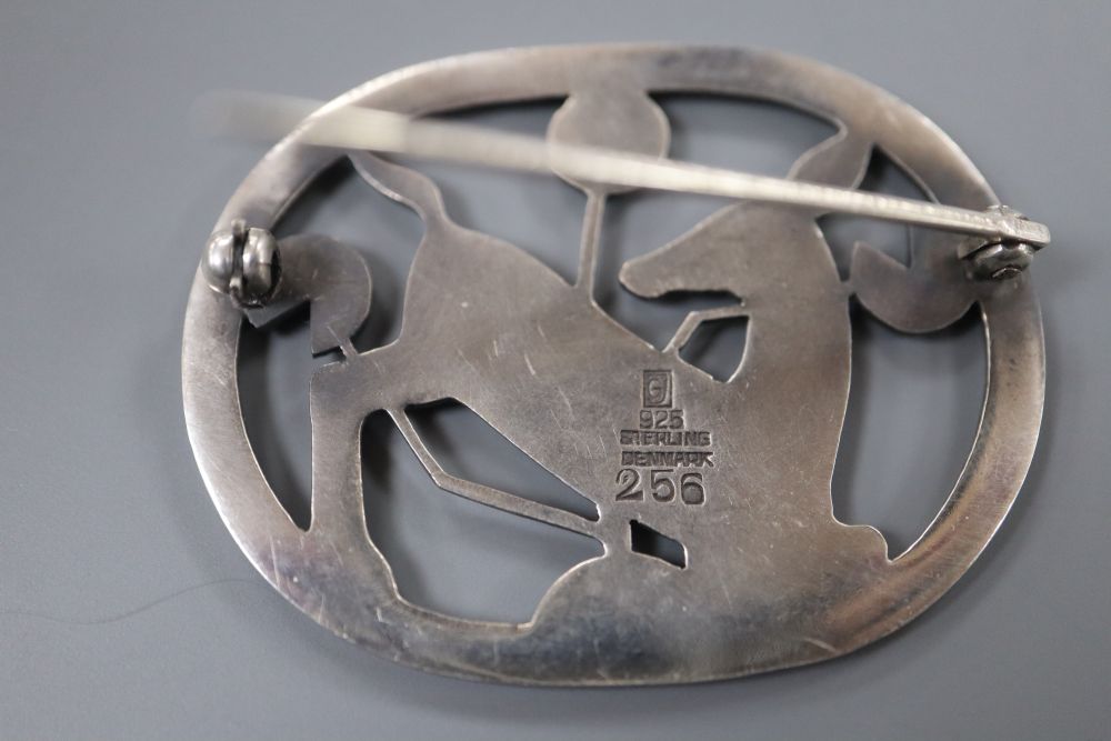 A 1933-1944 Georg Jensen sterling kneeling deer oval brooch, design no. 256, 43mm, gross 12 grams.